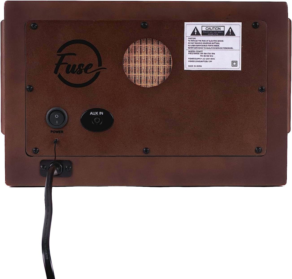 Rear panel of vintage radio with power and AUX In ports and control buttons