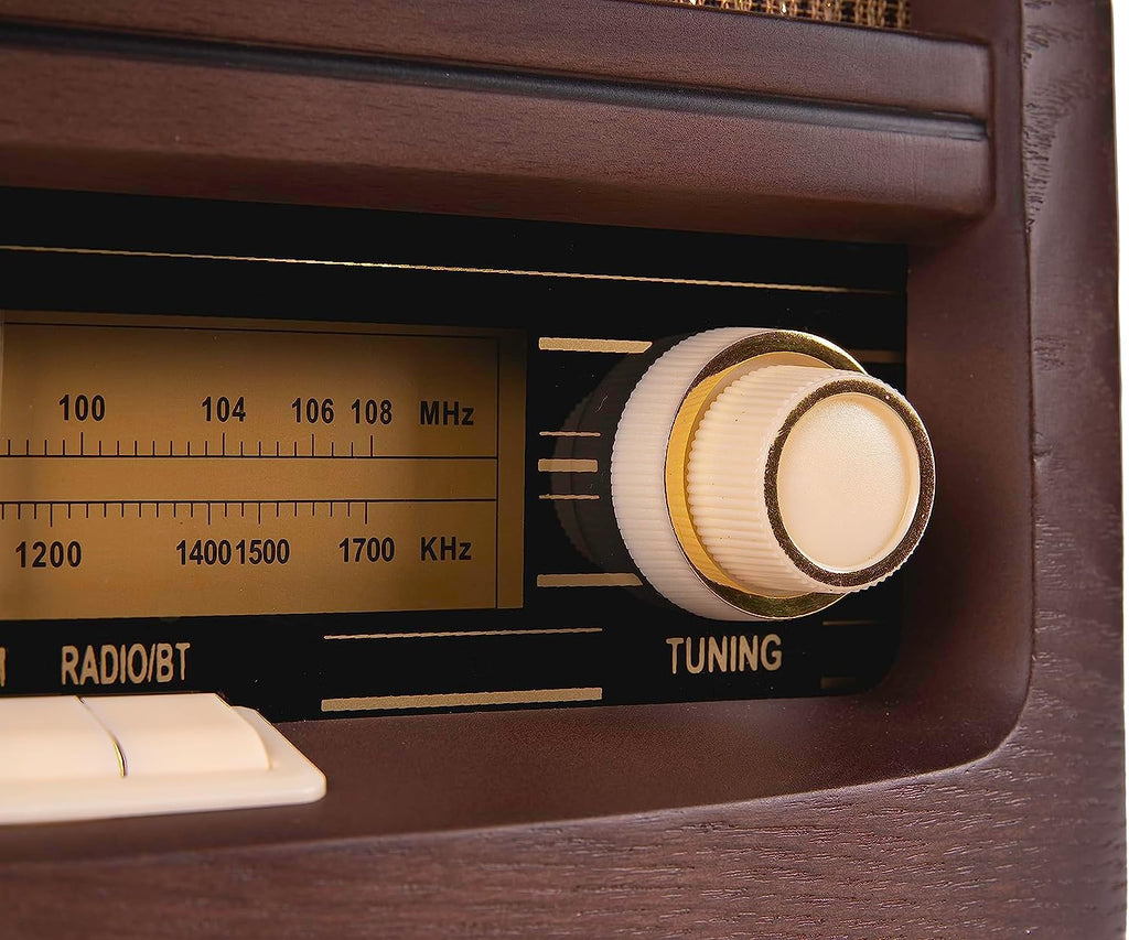Close-up of vintage radio tuning dial and frequency scale on the front panel