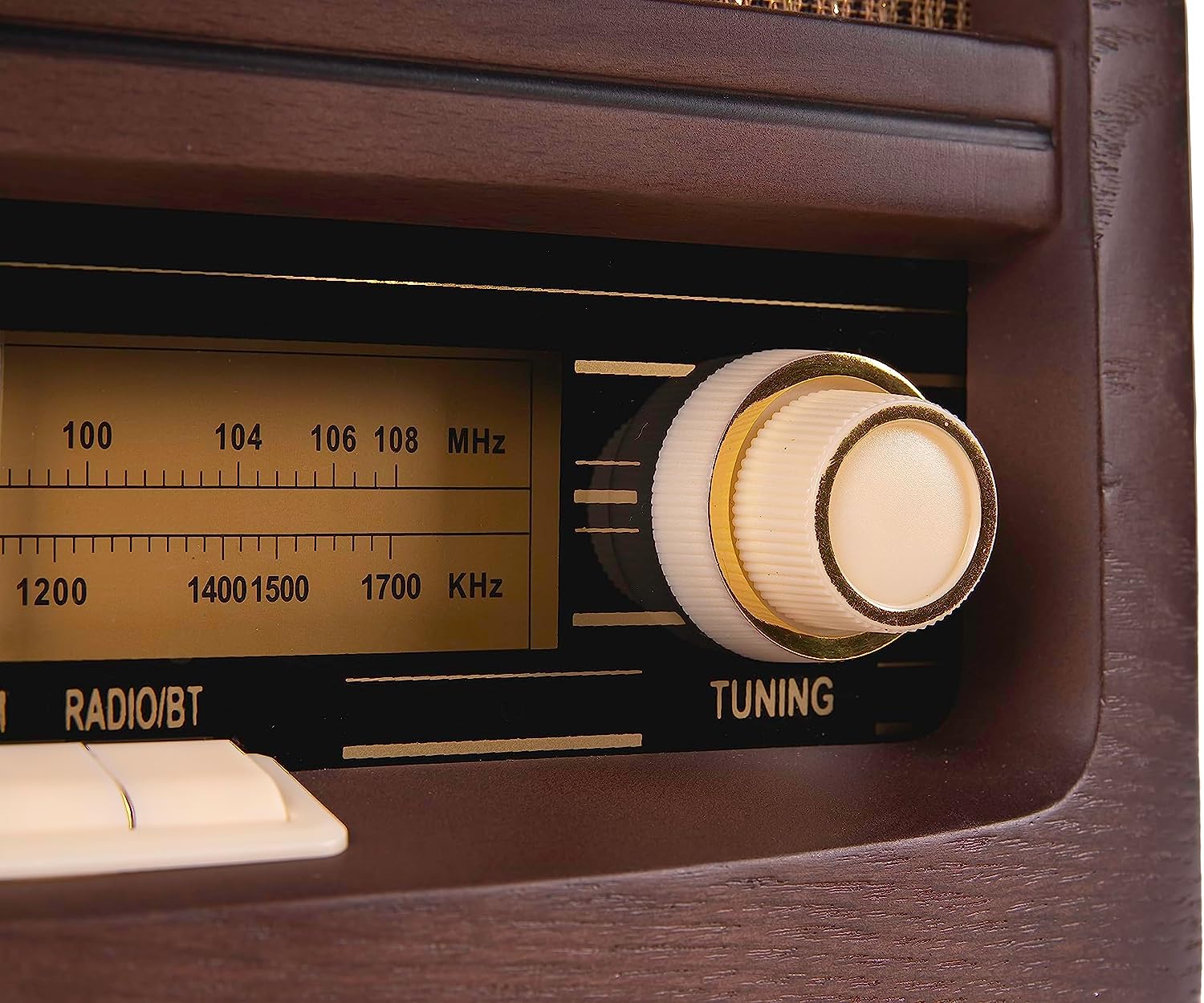 Close-up of vintage radio tuning dial and frequency scale on the front panel