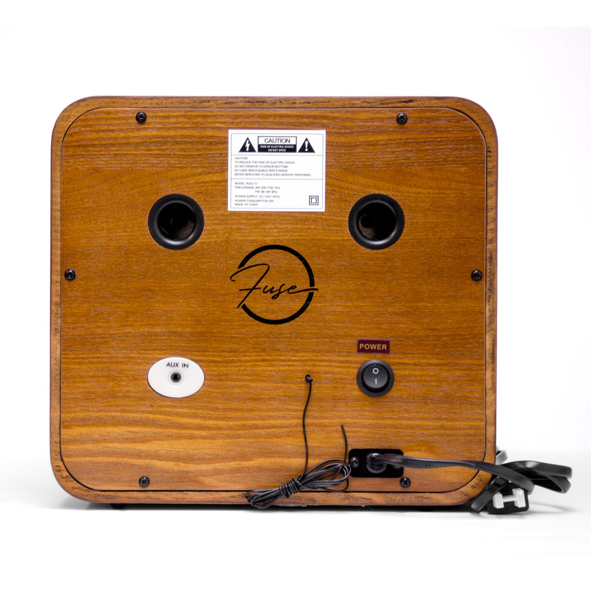 Wooden radio back panel with CAUTION label, speaker ports, power switch and cord