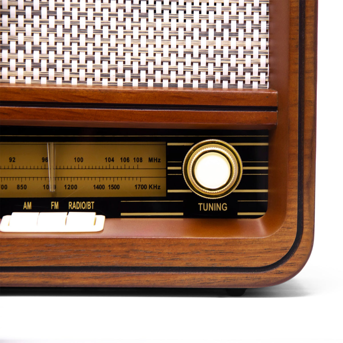 Wooden radio front corner with tuning knob and AM/FM frequency scale