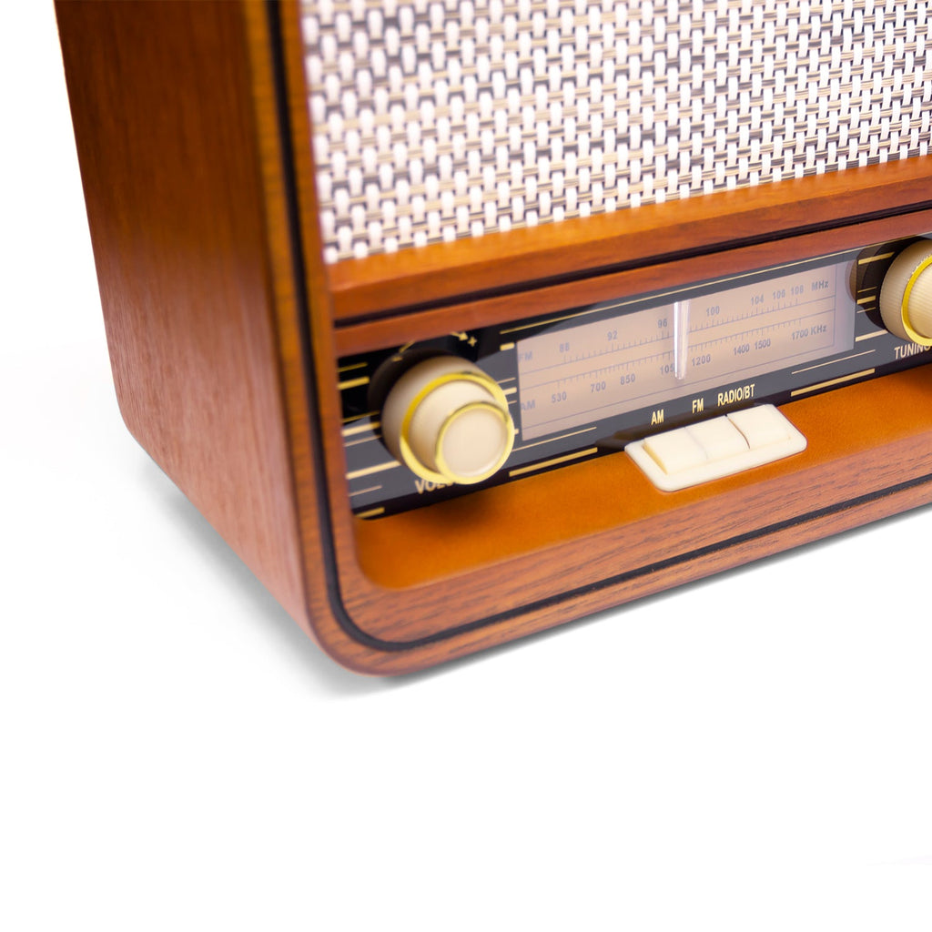 Wooden radio front edge with volume knob, station scale, and tuning control