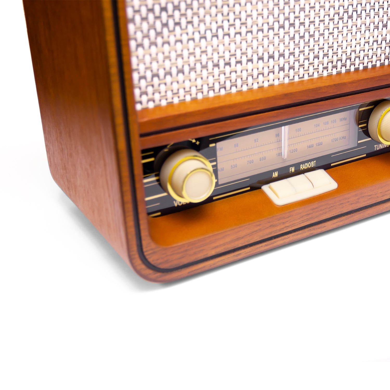 Wooden radio front edge with volume knob, station scale, and tuning control